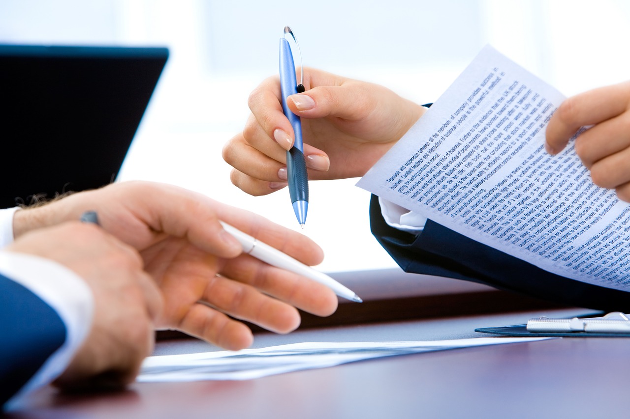 People examining paper